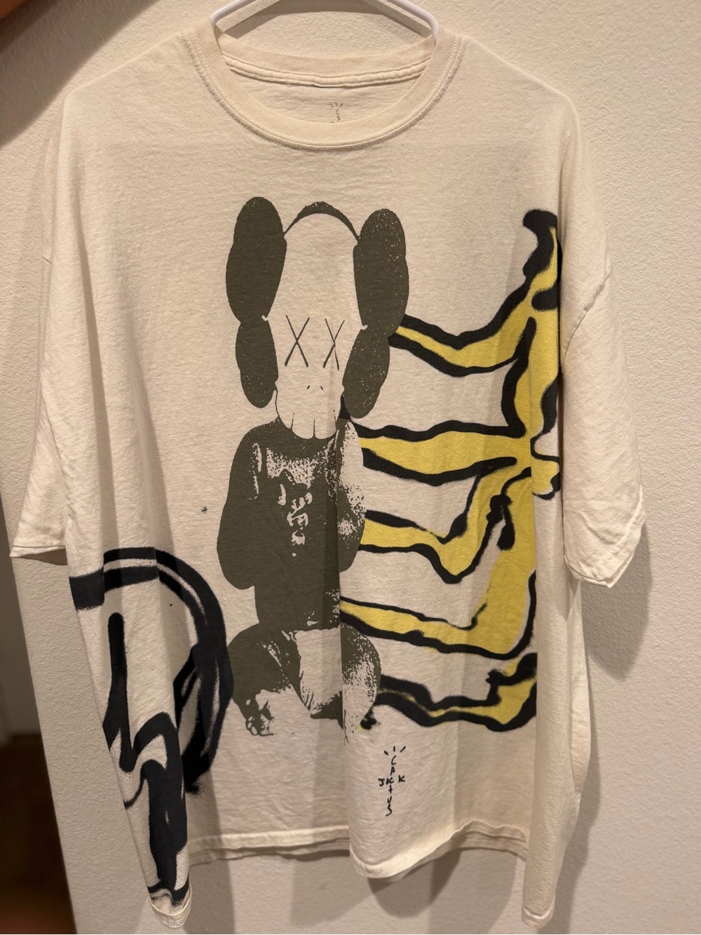 Cactus Jack by Travis Scott X KAWS Cream Graphic Tee with Black Print